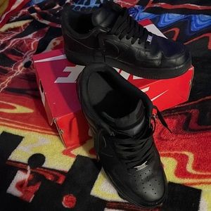 Nike Air Force 1 s triple black low tops